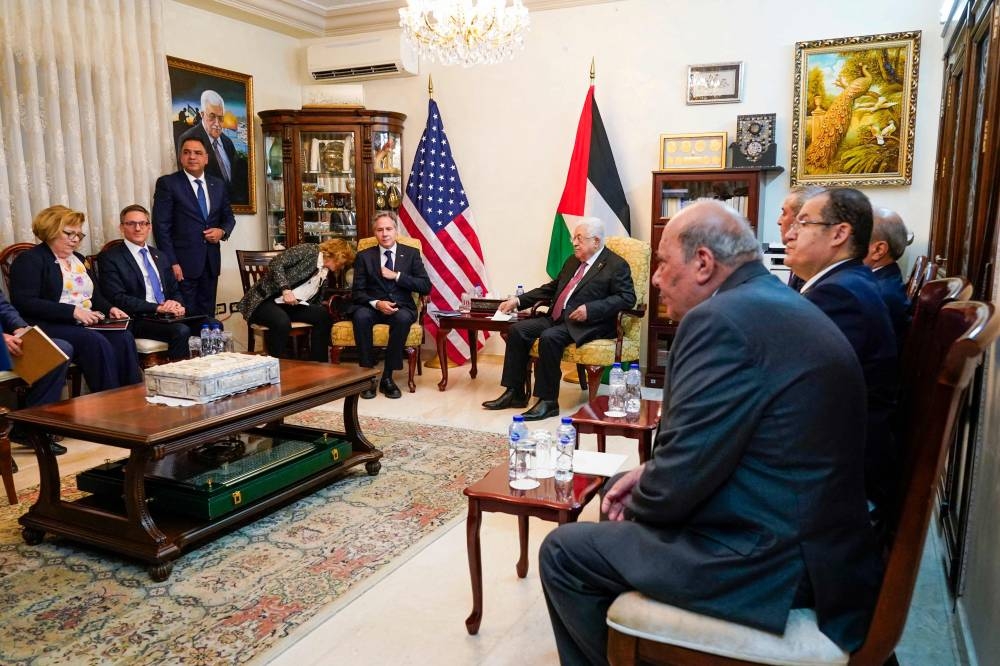 US Secretary of State Antony Blinken (center-L) holds a meeting  with Palestinian president Mahmud Abbas (center-R) in Amman Friday. Jacquelyn Martin/POOL/AFP