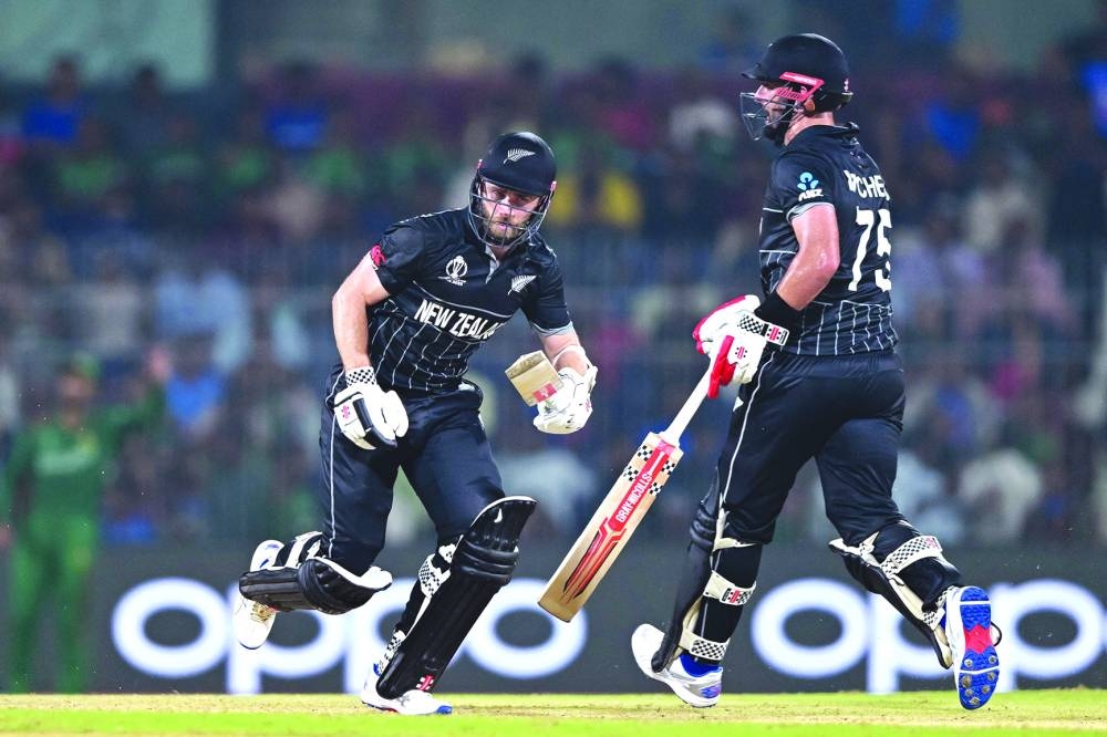 New Zealand’s captain Kane Williamson (left) and Daryl Mitchell run between the wickets during the World Cup match against Bangladesh at the M A Chidambaram Stadium in Chennai on Friday. (AFP)