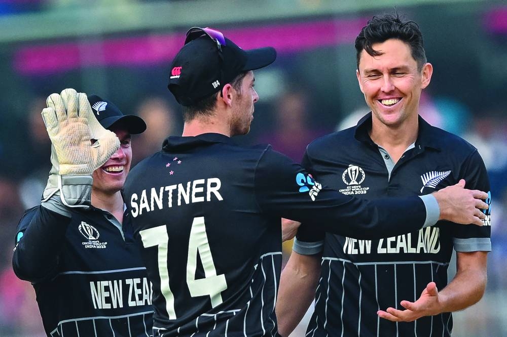 New Zealand’s Trent Boult (right) celebrates with teammates after taking the wicket of Bangladesh’s Towhid Hridoy during the World Cup match against Bangladesh at the M A Chidambaram Stadium in Chennai on Friday. (AFP)