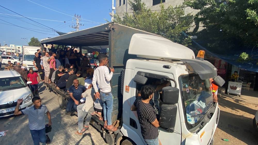 Mourners attend the funeral of Palestinians from al-Agha family, who were killed in Israeli strikes, in Khan Younis in the southern Gaza Strip Saturday. REUTERS