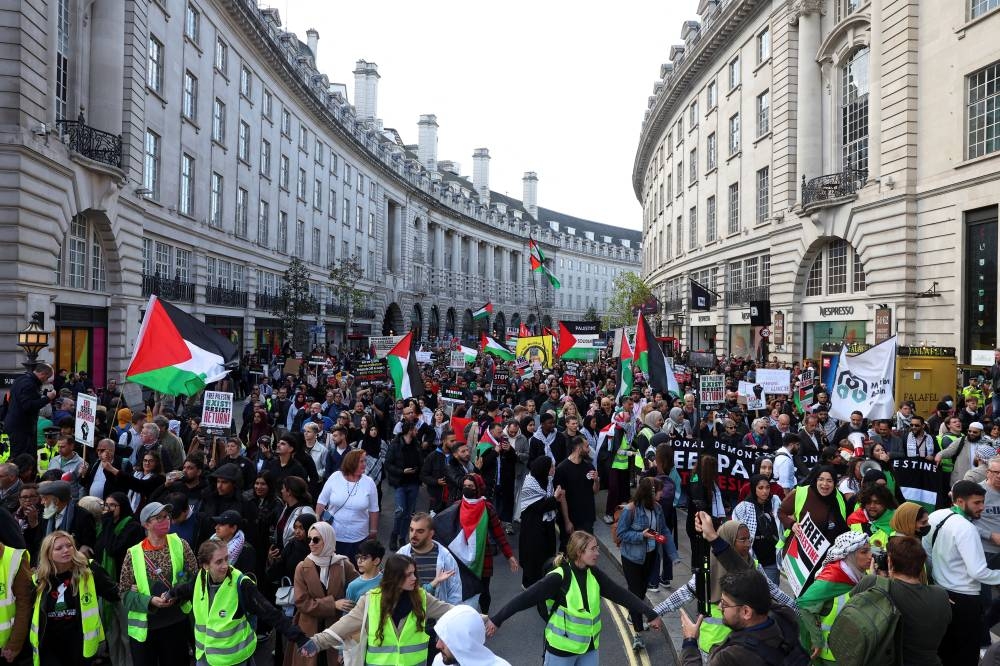 Demonstrators protest in solidarity with Palestinians, in London, Saturday. REUTERS