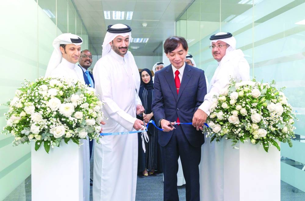 HE al-Mannai, Metoki and top officials inaugurating the UPU's Doha office.