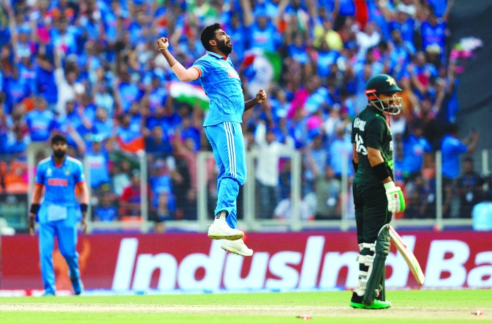 India’s Jasprit Bumrah (centre) celebrates after taking the wicket of Pakistan’s Mohamed Rizwan in Ahmedabad on Saturday.  (Reuters)
