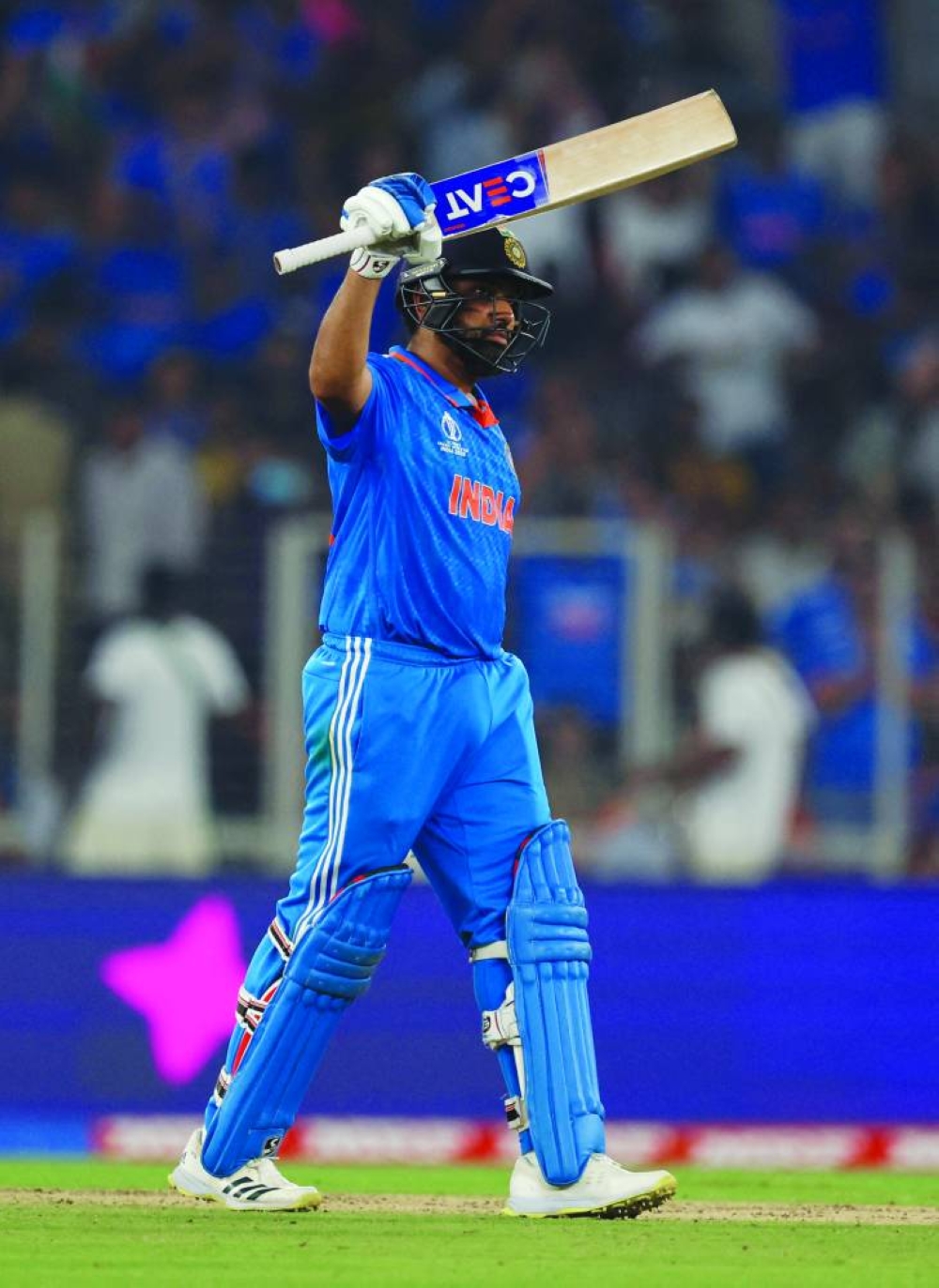 Rohit Sharma celebrates after reaching his half century during the 2023 ICC Men’s Cricket World Cup one-day international match between India and Pakistan on Saturday. (Reuters)
