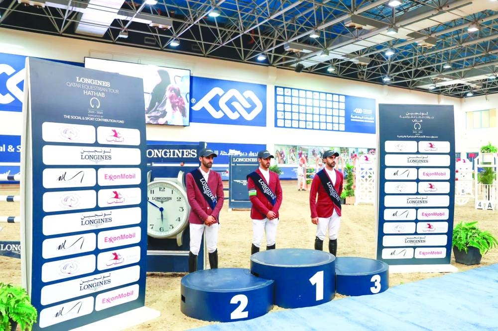 
The top three finishers of the Open class pose on the podium.
 