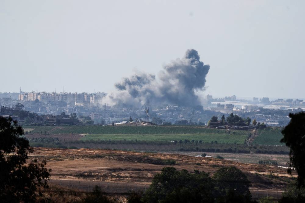 Smoke rises in the air following Israeli bombings in Gaza, as seen from Israel's border with the Gaza Strip, in southern Israel Sunday. REUTERS