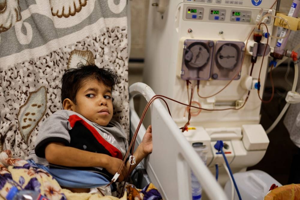 A Palestinian kidney patient lies on a hospital bed, as health officials say they are running out of fuel to operate dialysis devices, amid the ongoing Israeli-Palestinian conflict, at Naser hospital in Khan Younis in the southern Gaza Strip Sunday. REUTERS
