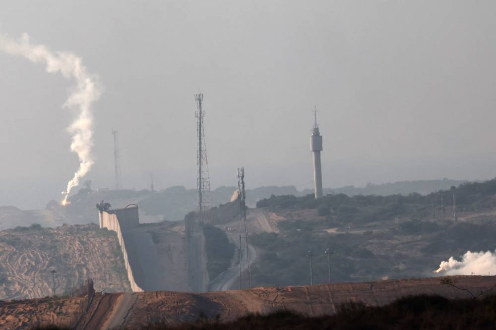A picture taken from the southern Israeli town of Sderot shows flares fired by the Israeli army above the northern border of the Gaza Strip on Monday. AFP