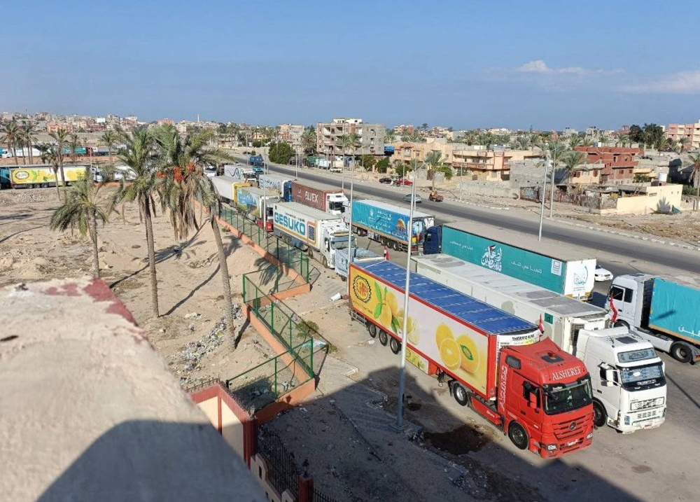 A view of trucks carrying humanitarian aid for Palestinians, as they wait for the re-opening of the Rafah border crossing to enter Gaza, amid the ongoing conflict between Israel and the Palestinian Islamist group Hamas, in the city of Al-Arish, Sinai peninsula, Egypt, Monday. REUTERS