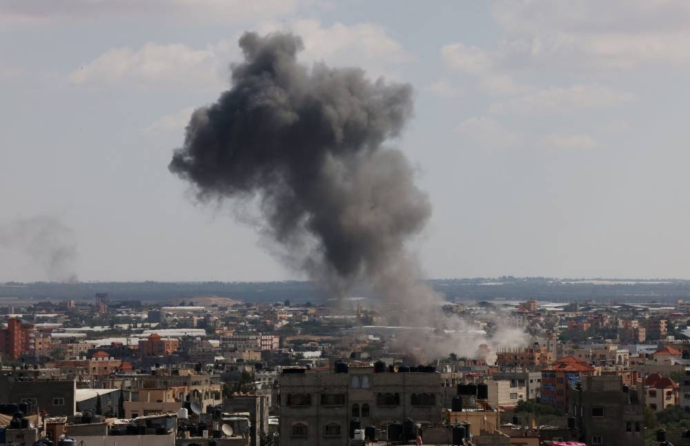 Smoke billows after an Israeli airstrike at the Rafah refugee camp, in the southern Gaza Strip Tuesday. AFP