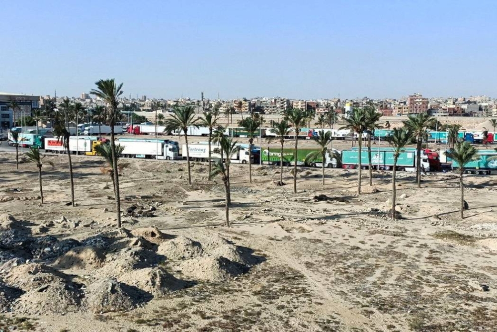 A view of trucks carrying humanitarian aid for Palestinians, as they wait for the re-opening of the Rafah border crossing to enter Gaza, amid the ongoing conflict between Israel and the Palestinian Islamist group Hamas, in the city of Al-Arish, Sinai peninsula, Egypt, Tuesday. REUTERS
