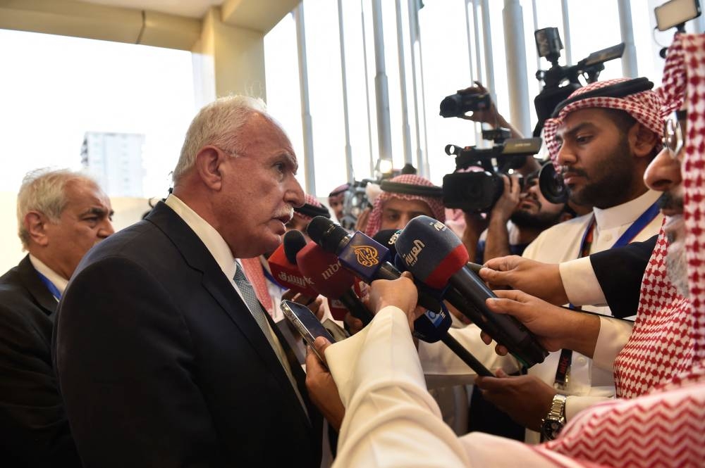 Palestinian Foreign Minister Riyad al-Maliki talks to the press after an extraordinary meeting of the Organisation of Islamic Cooperation's (OIC) executive committee regarding the situation in the Gaza Strip in the Saudi city of Jeddah on Wednesday. AFP