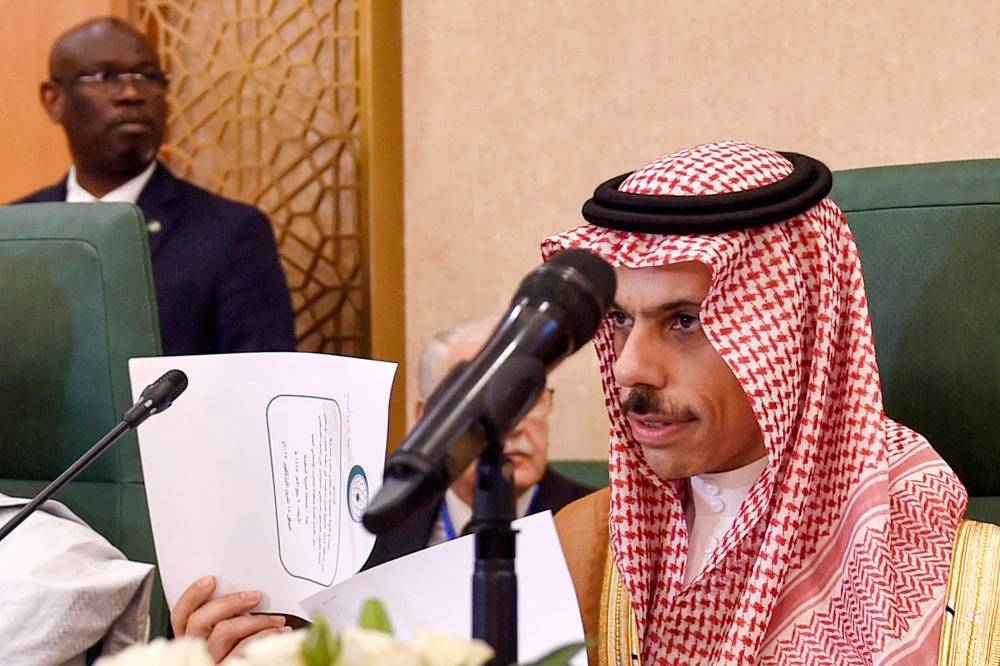 Saudi Arabia's Foreign Minister Prince Faisal bin Farhan (R) chairs an extraordinary meeting of the Organisation of Islamic Cooperation's (OIC) executive committee regarding the situation in the besieged Gaza Strip in Jeddah on Wednesday. AFP