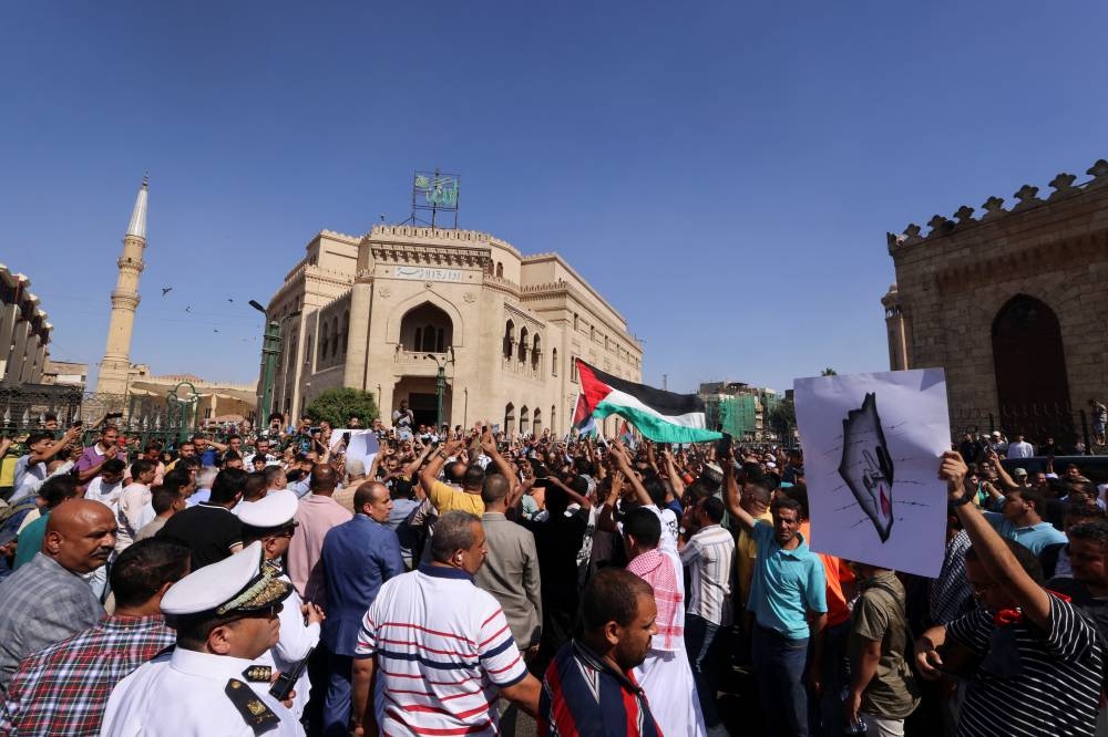 People take part in a protest in support of Palestinians, amid the ongoing conflict between Israel and Palestinian Islamist group Hamas, at al-Azhar Mosque in Old Cairo, Egypt, Friday. REUTERS