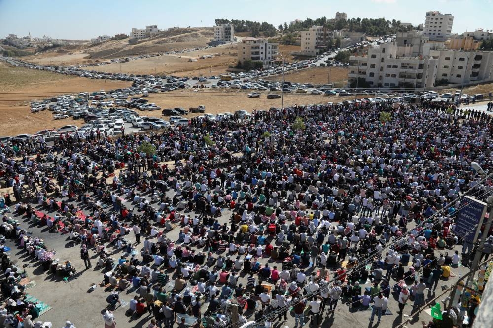 Jordanians gather during a pro-Palestinian protest to express solidarity with Palestinians in Gaza, in Amman, Jordan, Friday. REUTERS