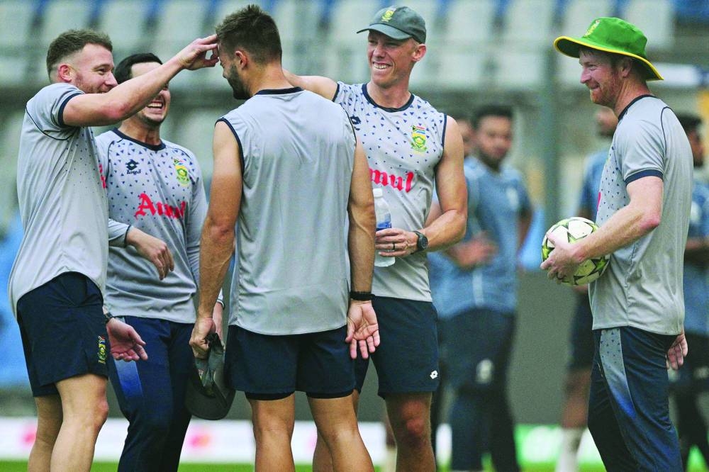 South African players share a light moment during a training session in Mumbai. (AFP)