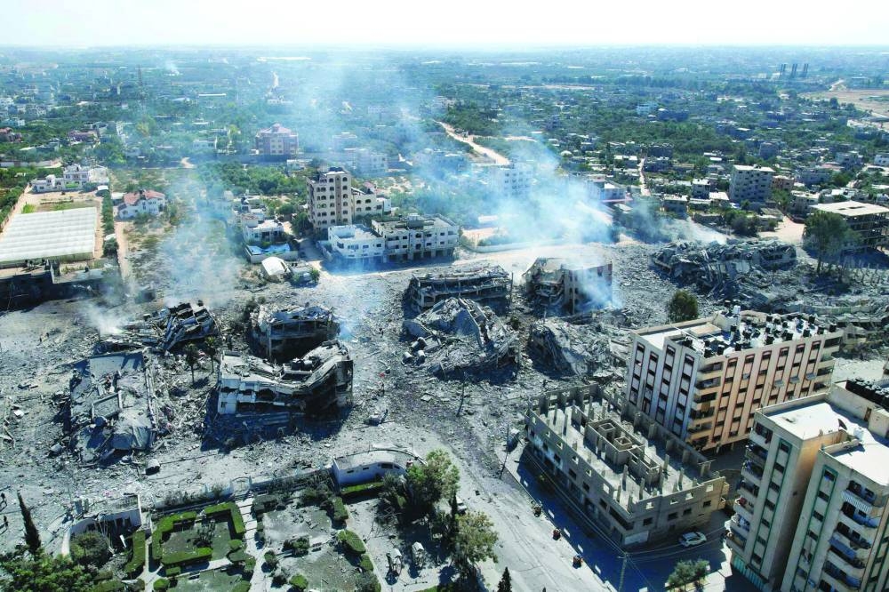An aerial view shows destroyed buildings in Al-Zahra city south of Gaza City, on Friday, following Israeli bombardment overnight.