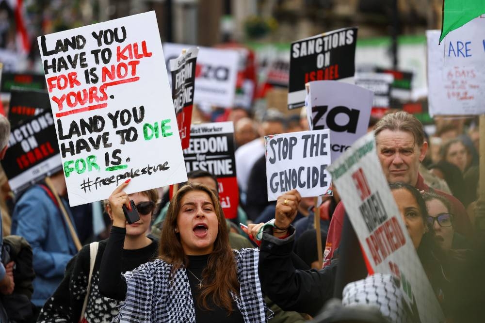 Demonstrators protest in solidarity with Palestinians in Gaza, amid the ongoing conflict between Israel and the Palestinian group Hamas, in London, Saturday. REUTERS