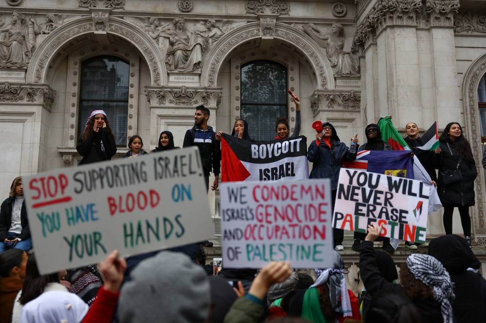 Demonstrators protest in solidarity with Palestinians in Gaza, amid the ongoing conflict between Israel and the Palestinian group Hamas, in London, Saturday. REUTERS