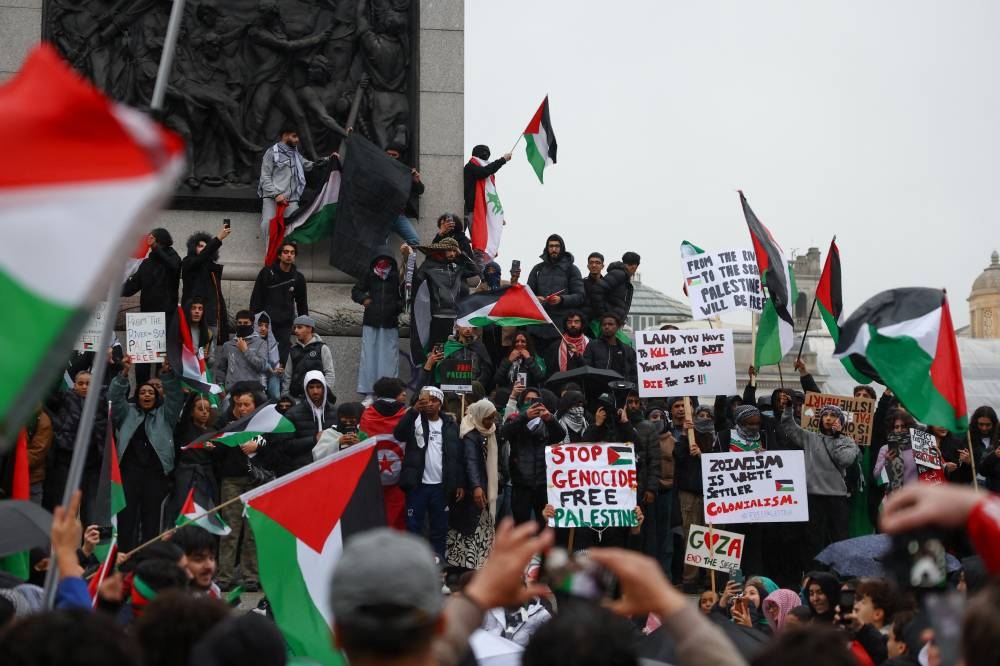 Demonstrators protest in solidarity with Palestinians in Gaza, amid the ongoing conflict between Israel and the Palestinian group Hamas, in London, Saturday. REUTERS