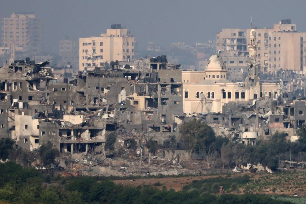 This picture taken from Israel's southern city of Sderot shows damaged buildings in the northern Gaza Strip on Sunday. AFP