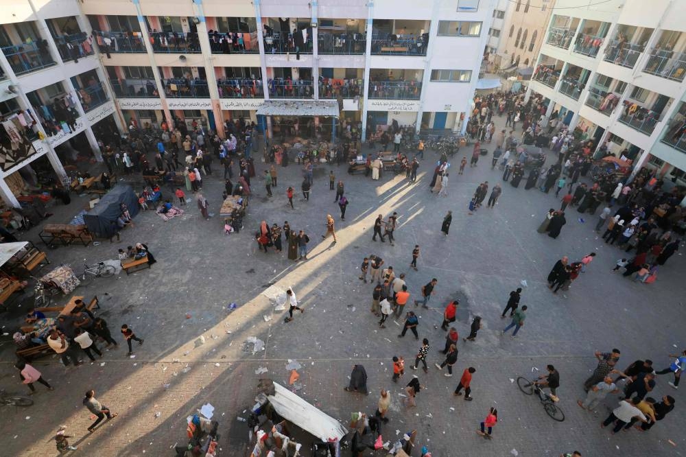 Internally displaced Palestinians are pictured in an United Nations Relief and Works Agency for Palestine Refugees (UNRWA) school in Khan Yunis, in the southern Gaza Strip on Saturday. AFP