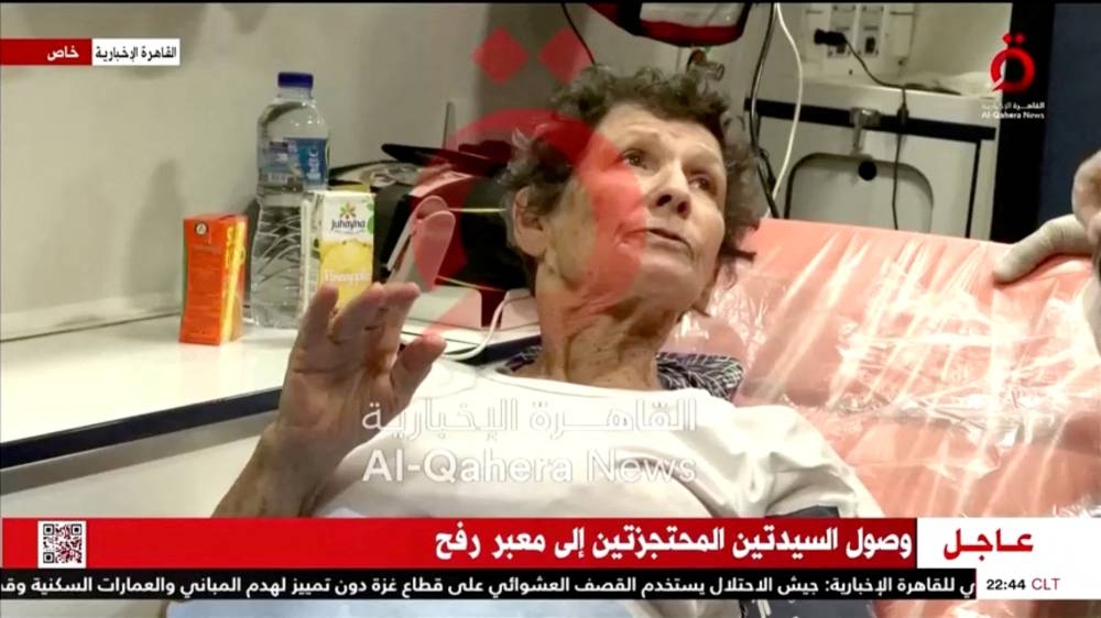 Yocheved Lifshitz and Nurit Cooper (also known as Nurit Yitzhak, not pictured) who were held hostages by Palestinian Hamas militants, are transported after being released by the militants to Israel, in this video screengrab, Monday.  Al Qahera News/Handout via REUTERS 