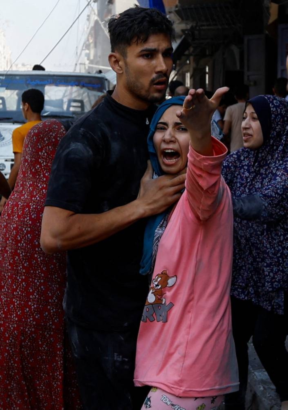 Palestinians react at the site of an Israeli strike on a house, in Khan Younis, in the southern Gaza Strip, on Tuesday. REUTERS