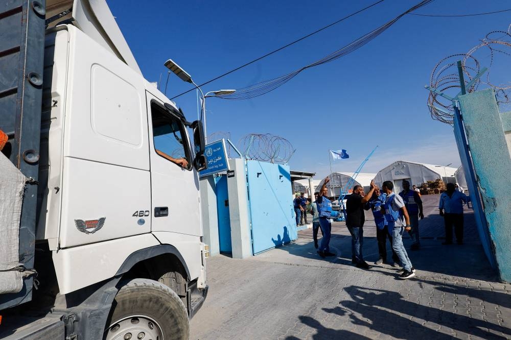 An aid truck arrives at a UN storage facility as the conflict between Israel and Palestinian Islamist group Hamas continues, in the central Gaza Strip on October 21. REUTERS