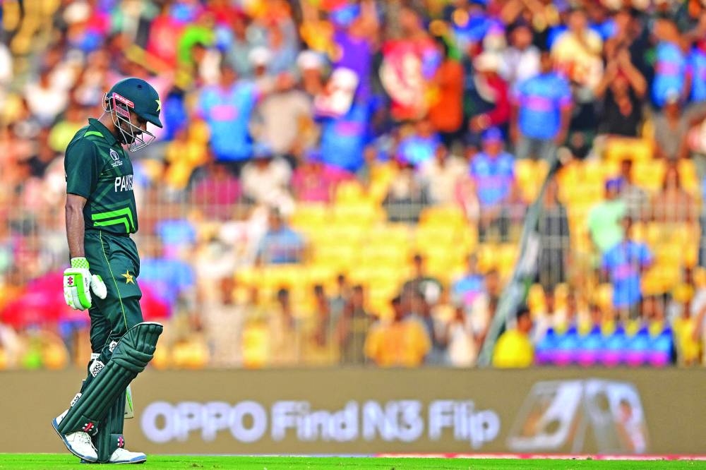 
Pakistan’s captain Babar Azam walks back to the pavilion after his dismissal during the 2023 ICC Men’s Cricket World Cup match against Afghanistan in Chennai on Monday. (AFP) 