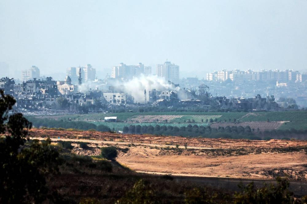 A view shows smoke in the Gaza Strip as seen from Israel's border with the Gaza Strip, in southern Israel on Wednesday. REUTERS