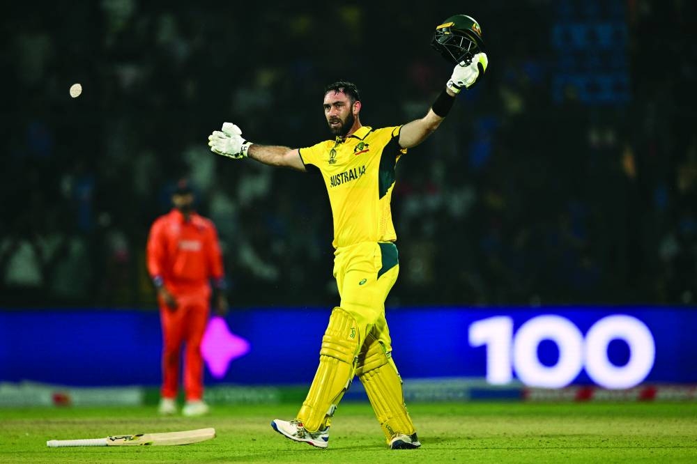 Australia’s Glenn Maxwell celebrates after scoring a hundred during the ICC World Cup one-day international match against the Netherlands in New Delhi on Wednesday. (AFP)