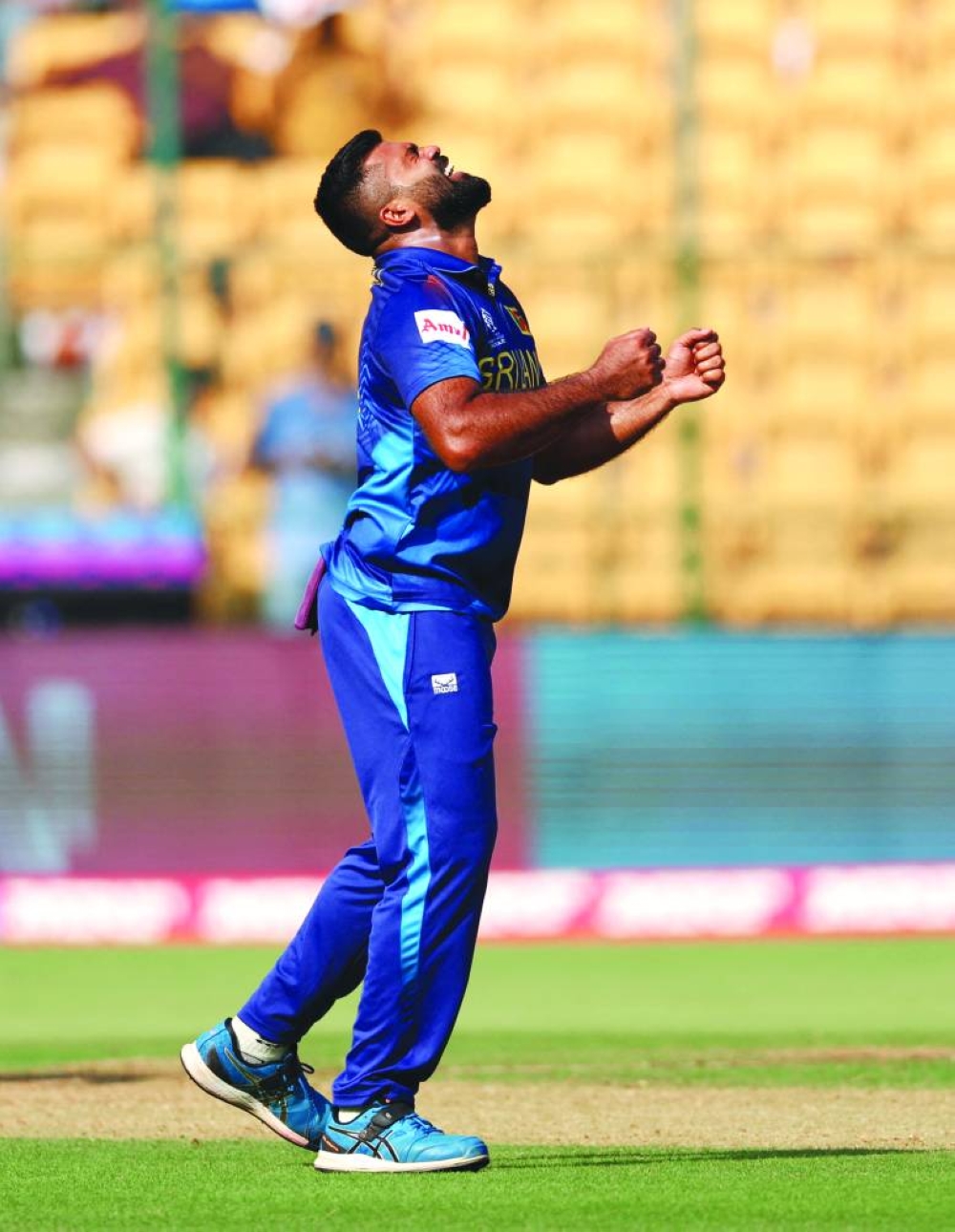 Sri Lanka’s 
Lahiru Kumara celebrates after taking the lbw wicket of England’s Liam Livingstone in Bengaluru on Thursday. (Reuters)