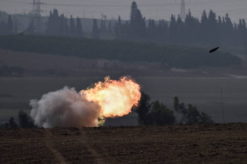 The Israeli military fires shells toward the Gaza Strip on Saturday. AFP