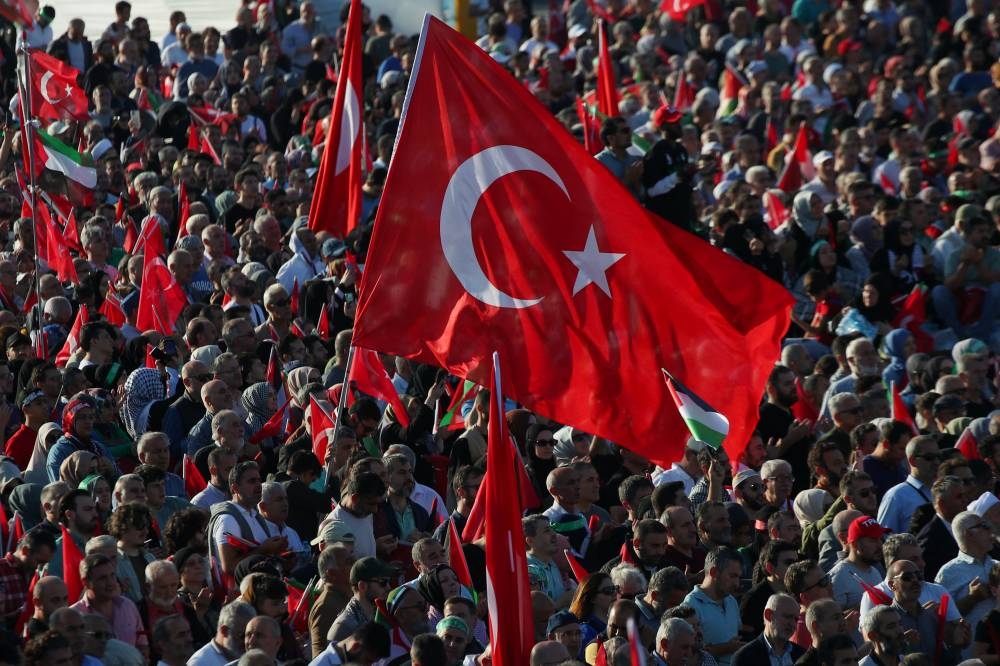 People attend a rally in solidarity with Palestinians in Gaza in Istanbul, Saturday. REUTERS