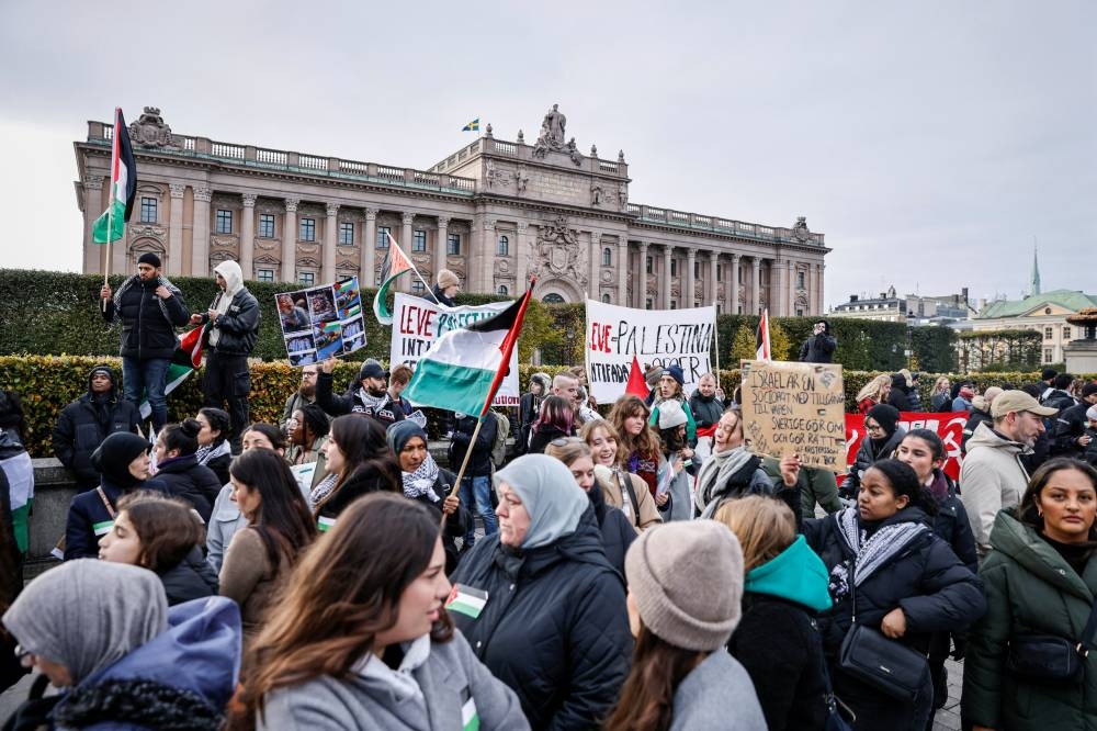 People take part in a protest in support of Palestinians in Gaza in Stockholm, Sweden Saturday.   Caisa Rasmussen/TT News Agency/via REUTERS 