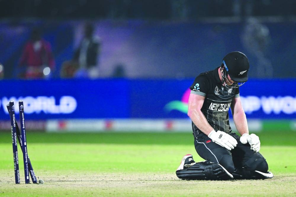 New Zealand’s James Neesham reacts after run out during the World Cup match against Australia at the Himachal Pradesh Cricket Association Stadium in Dharamsala on Saturday. (AFP)