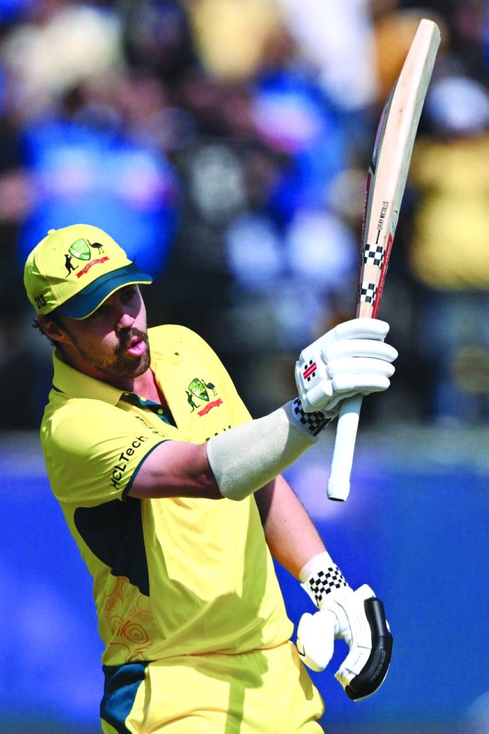Australia’s Travis Head celebrates after scoring a century during the World Cup match against New Zealand at the Himachal Pradesh Cricket Association Stadium in Dharamsala on Saturday. (AFP)