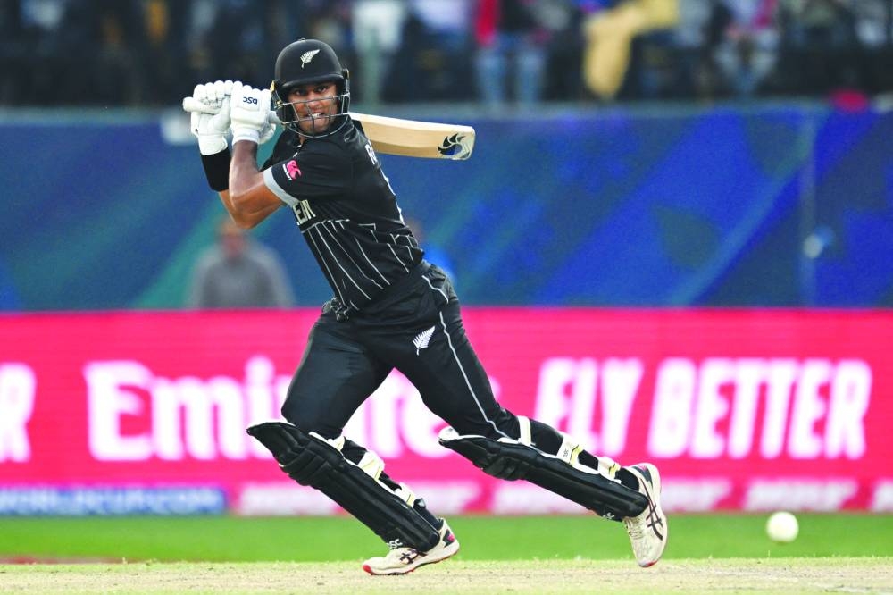 New Zealand’s Rachin Ravindra plays a shot during the World Cup match against Australia in Dharamsala on Saturday. (AFP)