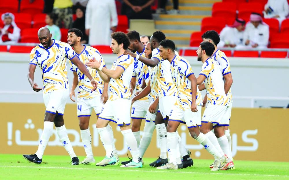 Al Gharafa players celebrate after their win over Al Rayyan at the Ahmad Bin Ali Stadium on Saturday.