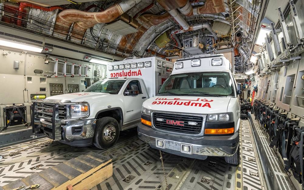 Humanitarian aid bound for the Gaza Strip through Egypt's northern Rafah border crossing, being loaded into a military aircraft at the International Airport in Kuwait City. AFP/KUNA