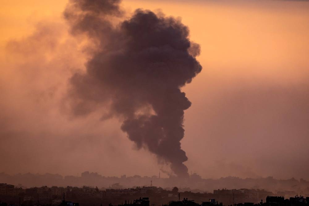 A picture taken from Israel's southern city of Sderot shows smoke rising during Israeli bombardment of the Gaza Strip on Sunday. AFP