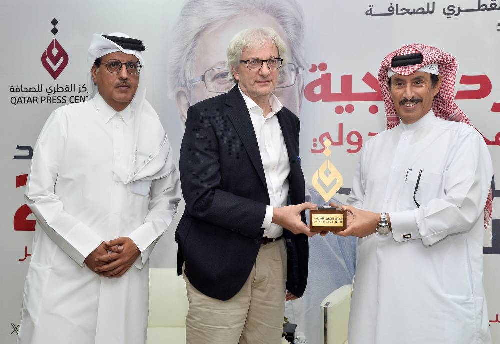 QPC president Saad bin Mohamed al-Rumaihi (right) and director-general Sadiq al-Amari presenting Hearst with a QPC shield. PICTURE: Shaji Kayamkulam