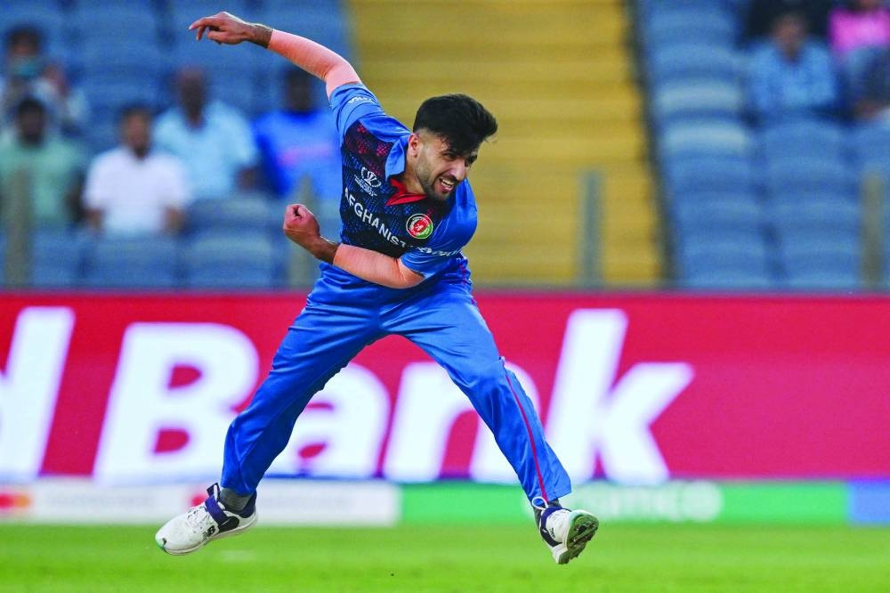 Afghanistan’s Fazalhaq Farooqi bowls during the World Cup match against Sri Lanka at the Maharashtra Cricket Association Stadium in Pune on Monday. (AFP)