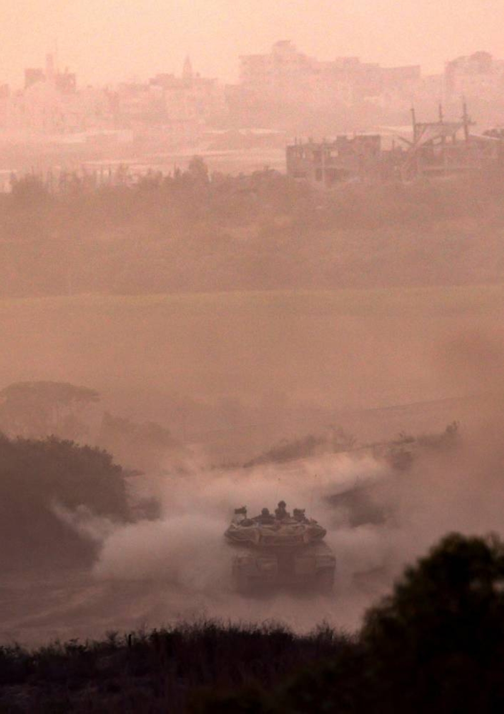 An Israeli tank drives near the border with Gaza Strip, in Israel,  Tuesday. REUTERS
