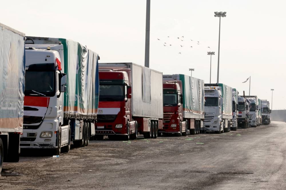 Trucks carrying humanitarian aid for Palestinians, are seen on the day of Egyptian Prime Minister Mostafa Madbouly's visit to the Rafah border crossing between Egypt and the Gaza Strip, in Rafah, Egypt, on Tuesday. REUTERS
