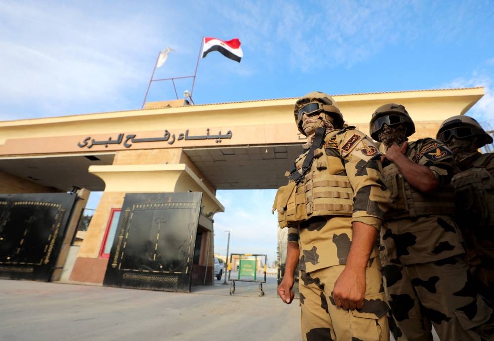 Military personnel stand guard on the day of Egyptian Prime Minister Mostafa Madbouly's visit to the Rafah border crossing between Egypt and the Gaza Strip, in Rafah, Egypt, Tuesday. REUTERS