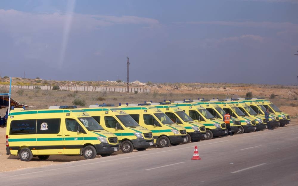Ambulances are seen on the day of Egyptian Prime Minister Mostafa Madbouly's visit to the Rafah border crossing between Egypt and the Gaza Strip, in Rafah, Egypt on Tuesday. REUTERS