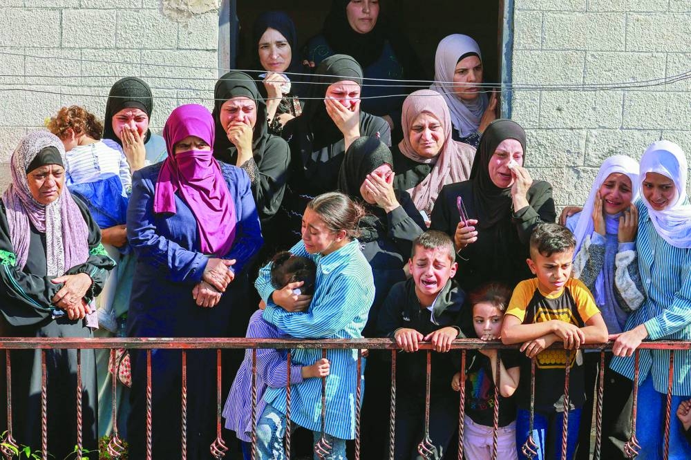 Relatives of Rawhe Sawafta, 70, who was killed during clashes with Israeli forces, mourn during his funeral in Tubas in the occupied West Bank, on Tuesday.