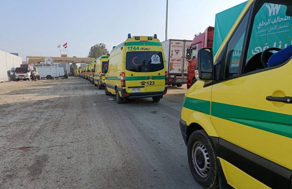 Egyptian ambulances which will carry critically injured people, drive through the Rafah crossing from the Egyptian side, amid the ongoing conflict between Israel and the Palestinian Islamist group Hamas, in Rafah, Egypt November 1, 2023. REUTERS/Stringer